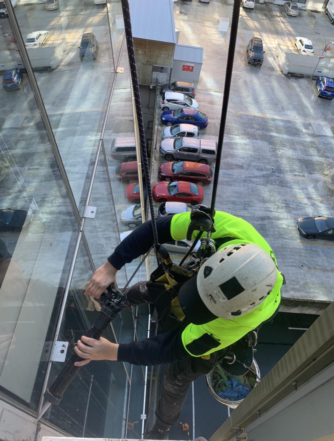 Rope access technician working on a Wellington building facade
