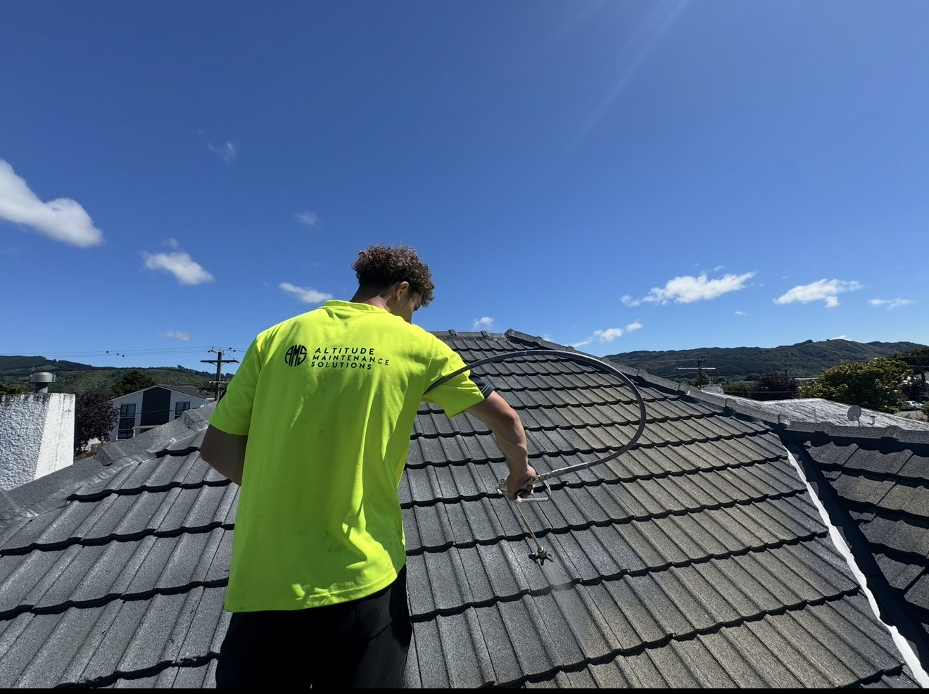 Altitude Maintenance technician restoring a tiled roof